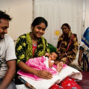 Image of family at Smiling Sun health clinic in Dhaka, Bangladesh