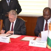U.S. Ambassador Terence P. McCulley and the Minister of Foreign Affairs, Dr. Abdallah Albert Toikeusse Mabri, sign the Grant Agr