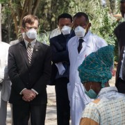 U.S. Deputy Chief of Mission Peter Vrooman talks with a patient undergoing treatment for TB at the ALERT Center in Addis Ababa.