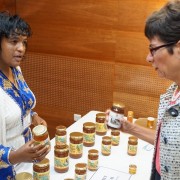 Simret Lulekal, the owner of SYE Agroindustry, discusses her company’s products with U.S. Ambassador Haslach. SYE works with 600