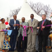 Bishoftu Hospital Officials are joined by representatives of the Oromia Health Bureau, Bishoftu town, and USAID to cut the ribbo