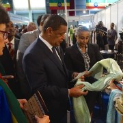 Ethiopian President Mulatu Teshome and U.S. Ambassador Haslach look at merchandise from one of the exhibits at the fifth Origin 