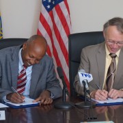 Central Statistical Agency Director General Biratu Yigezu (left) and USAID Ethiopia Mission Director Dennis Weller sign an agree