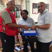 USAID/OFDA Disaster Relief Management Specialists  hand over the generators purchased by USAID