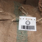 A traceability tag on a sack of coffee ready for export.