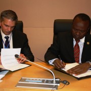 Assistant Administrator Earl Gast and Africa Union Commission Deputy Chairperson Mwencha sign implementation letter