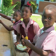 These students from St.Paul's primary School are saving water while using water-saving taps installed at the facility. 