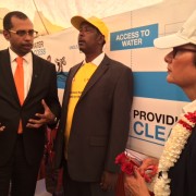 Belcash CEO Vince Mountaga Diop explains to U.S. Ambassador Haslach how HelloCash can be used to pay for water.