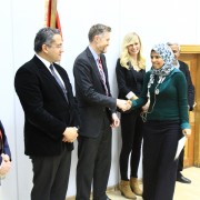 USAID/Egypt Economic Growth Director Brinton Bohling congratulates graduates who participated in a USAID-funded field school for Ministry of Antiquities employees. This field school provided hands-on learning opportunities to strengthen the site management skills of site inspectors.