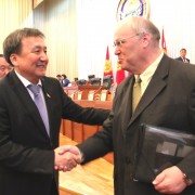 Kyrgyzstan Parliament Speaker Asylbek Jeenbekov thanks USAID Representative Carey Gordon