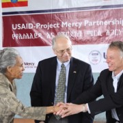 Project Mercy Executive Director Marta Gabre-Tsadick (left) and USAID Ethiopia Mission Director Dennis Weller shake hands