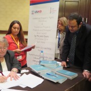 U.S. author Judy Winegar Goans and editor Nermine Al Ali sign copies of the Arabic-language Intellectual Property Textbook