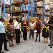 Officials tour the new Supply Chain Management Complex in Guyana during the close out of USAID's Supply Chain Management System 