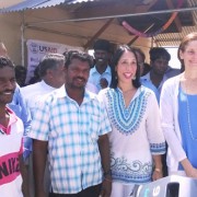 U.S. Ambassador Michele Sison and USAID Mission Director Sherry F. Carlin with local fishermen