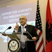 Ambassador Arvizu delivers remarks at a podium