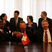Representatives of Governments of Sweden, U.S.A. and Switzerland shakes hands following signing of STAR agreement
