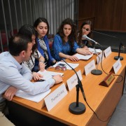 A team of law students compete in a debate at a court