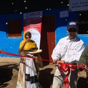 U.S. Deputy Chief of Mission to Ethiopia Peter Vrooman cuts a ribbon to officially open the first of up to 30 youth economic str