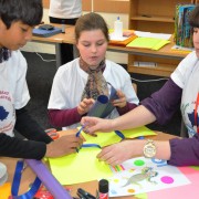 English speaking students from American School of Kosovas and their teacher during bookmaking activity.