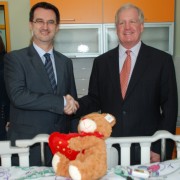 Minister of Health Dr. Ferid Agani and USAID Acting Mission Director Christopher Edwards admire the new, child friendly medical 