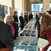 U.S. Charge d’Affaires (center, right)) Kelly Degnan admires exhibits at the local governance conference in Pristina.
