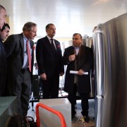 Ambassador Cekuta (center) tours the facility after the official opening. 