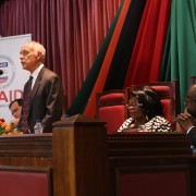 A photo of USAID/Zambia Mission Director Dr. Michael Yates addressing the Zambian Parliament advocating against GBV.