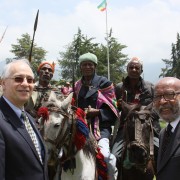 U.S. Ambassador Donald Booth (l) and Project Mercy Co-founder Deme Tekle-wold with local residents in a Gurage celebration.