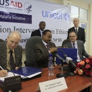 Ambassador Booth signs the new grant agreement with the Federal Ministry of Health and UNICEF.