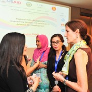 Acting Mission Director Carrie Thompson talks with participants at the Regional Policy Dialogue on Empowering Women Entrepreneur