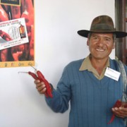 A farmer shows a sample of the chili peppers he sold at the International Red Chili Pepper Festival in Padilla, Bolivia.