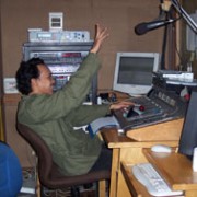 Radio News 68H technician Joni Yohanes broadcasting news that reaches eight million men and women across Indonesia and throughou