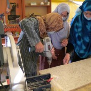 Women in tradition clothing in Afghanistan learning carpentry skills