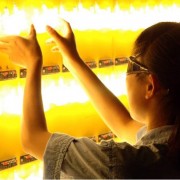 A woman inspects compact flourescent lights