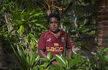 Jenny Songan stands in a mangrove forest in Papua New Guinea
